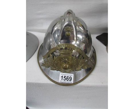 A French Sapeurs Pompiers Saints Cyprien fireman's helmet used by Fournet Thierry
