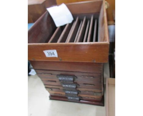 A vintage casino mahogany money sorter