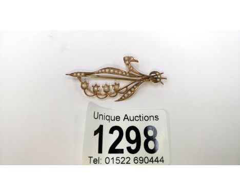 A Edwardian seed pearl set spray brooch in 9ct gold