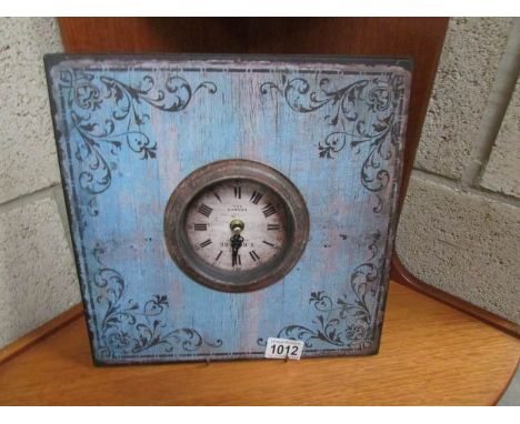 A metal shabby chic table clock