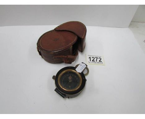 A first world war compass and case marked M.I.O., 1917