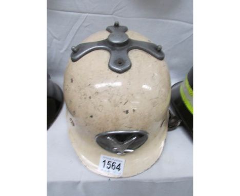 An old fireman's helmet marked Falck on sides