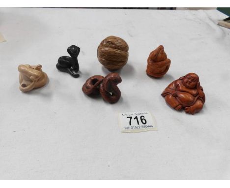 5 carved wood snake netsuke and a Buddha
