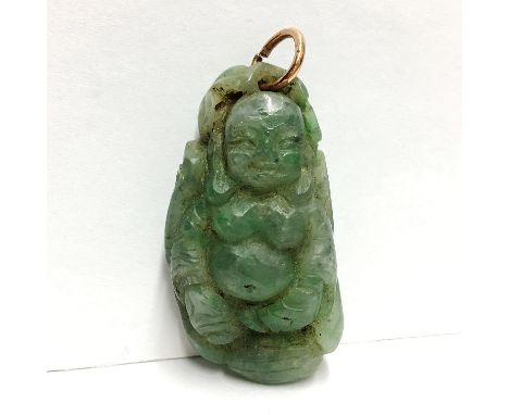 A Chinese Buddha motif gemstone on a pendant, apple green grossular garnet, circa 19th century, 26.36 grams, 42.3 x 22.6 x 14