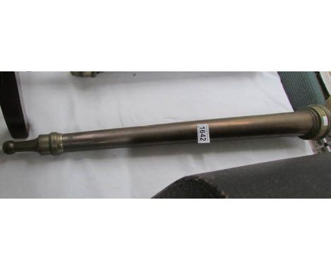 A vintage fire hose end nozzle marked R.I.K.