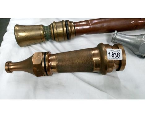 A vintage fire hose end nozzle