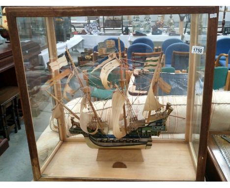 A good old model galleon in full sail and in case