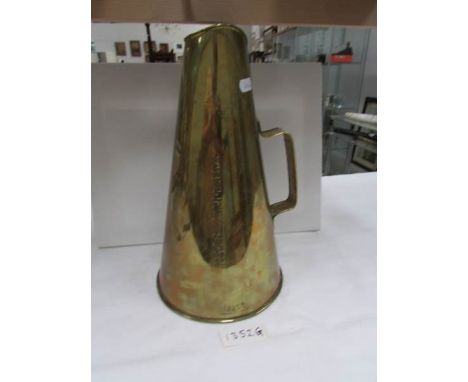 A brass megaphone stamped R.M.S. Carmania (Carmania was an ocean liner built by John Brown & Co., for Cunard Line)