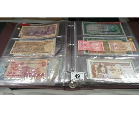 A folder of approximately 120 world bank notes, countries L - R