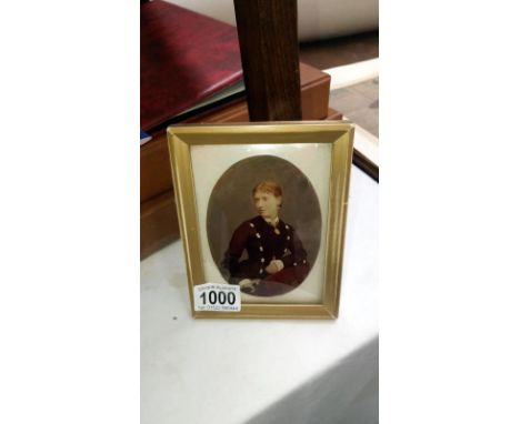 A framed and glazed oil painted portrait 'on verso' glass