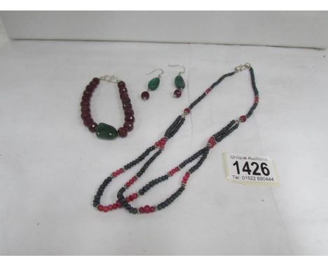 A garnet and jade necklace, bracelet and earrings