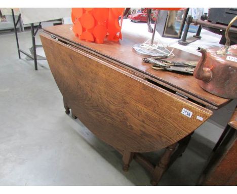 A period oak gate leg table