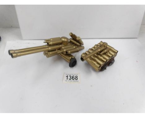 A model of a tank and a model of an artillery gun made from shell cases