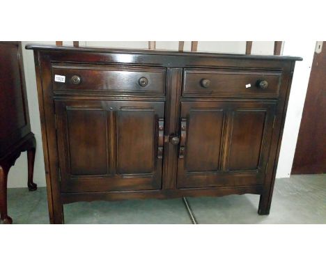 An Ercol oak sideboard