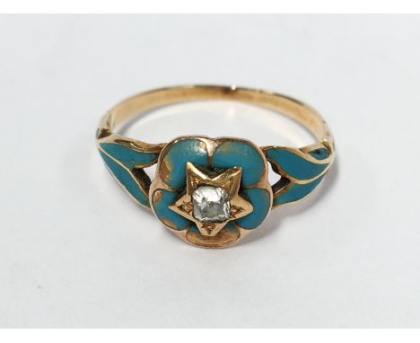 An old cut diamond and blue enamel ring circa 1890/1900 in gold setting