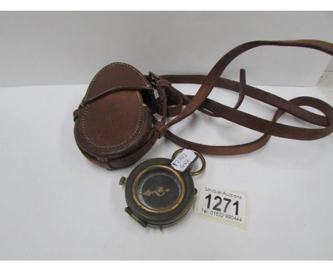 A first world war compass in case, marked No.69768 1917 and hand marked E.L.Thomson RW