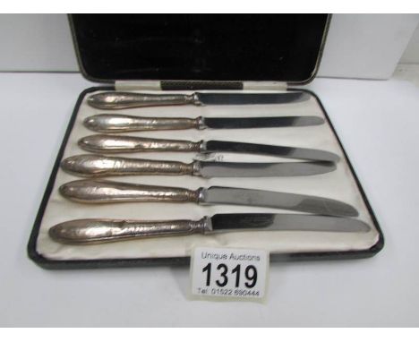 A cased set of vintage silver handled knives