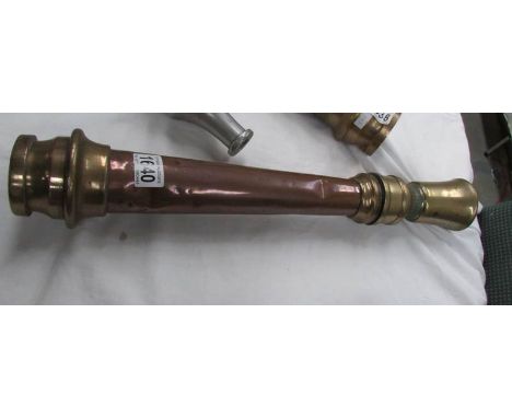 A vintage fire hose end nozzle spreader