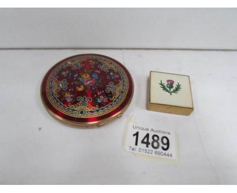 A round Stratton compact and  a small square Stratton compact with thistle motif