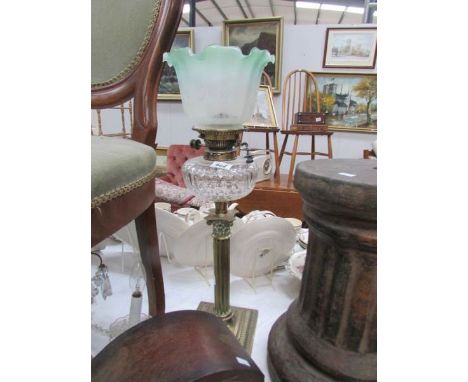 A brass Corinthian column oil lamp with glass font and later etched shade