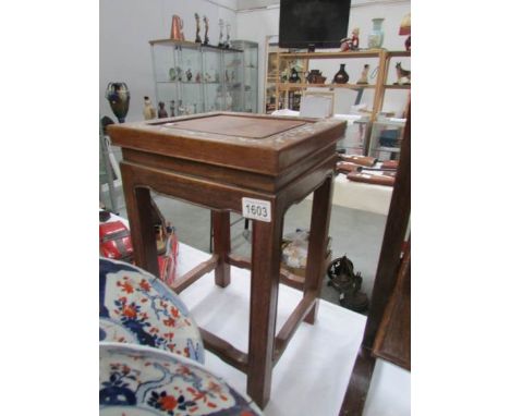 A 20th century Chinese hardwood stool with mother of pearl inlay