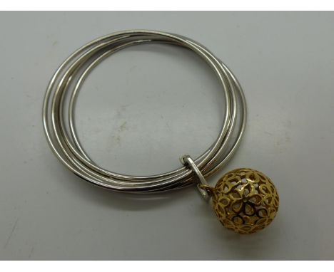 White metal bangle with gold plated circular charm, D: 70mm. UK P&amp;P Group 0 (£6+VAT for the first lot and £1+VAT for subs