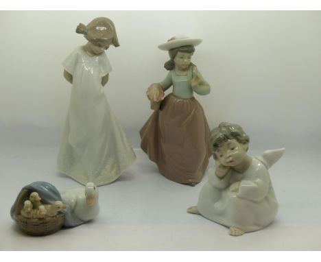 Three boxed Nao and one boxed Lladro figurines, no cracks or chips, Largest H: 20 cm. UK P&amp;P Group 3 (£30+VAT for the fir