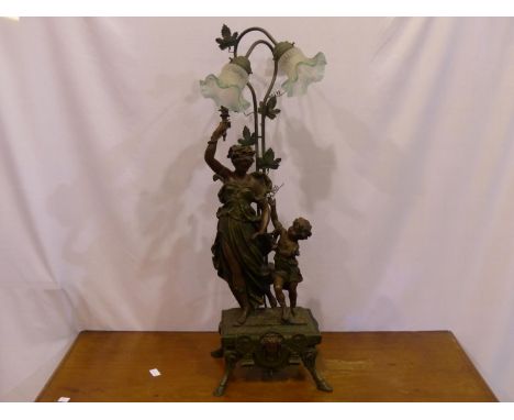 Large bronzed figural table lamp with glass shades, H: 96 cm, resin damage to fingers ( left ), scuff to right arm. Not avail