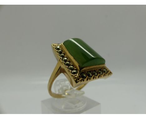 Unmarked 9ct gold ring set with large panel of jade surrounded by marcasite, size P/Q, 6.3g. UK P&amp;P Group 0 (£6+VAT for t