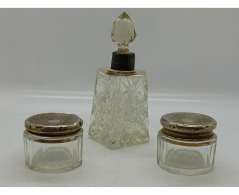 Two hallmarked silver topped jars and a hallmarked silver collared scent bottle. UK P&amp;P Group 2 (£20+VAT for the first lo