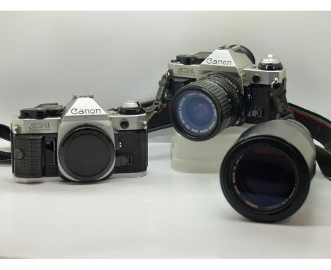 Two Canon AE1 cameras with Canon lenses. UK P&amp;P Group 2 (£20+VAT for the first lot and £4+VAT for subsequent lots) 