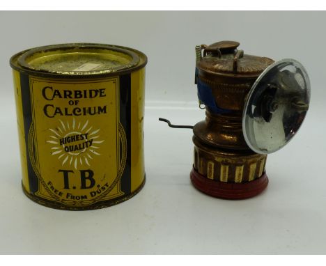 Vintage carbide lamp by Hanklin of Springfield together with a tin of carbide. UK P&amp;P Group 2 (£20+VAT for the first lot 