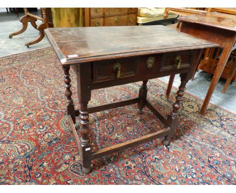 AN 18th.C.OAK SIDE TABLE WITH FRIEZE DRAWER OVER BOBBIN TURNED LEGS AND STRETCHER. W.77 x D.45. x H.73cms.