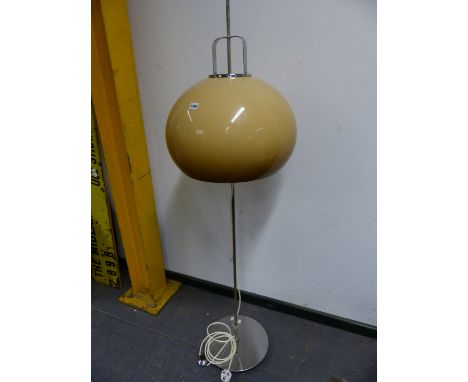 A CHROME STANDARD LAMP, THE COLUMN ON CIRCULAR FOOT, THE SHADE OF MUSHROOM SHAPE AND COLOUR, APPROXIMATELY. H 165cms.