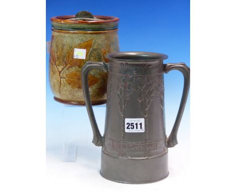 AN ENGLISH PEWTER ART NOUVEAU LOVING CUP, THE HONESTY SEED CAST CYLINDRICAL SIDES FLARING TO AN INSCRIPTION FOR OLD TIMES SAK