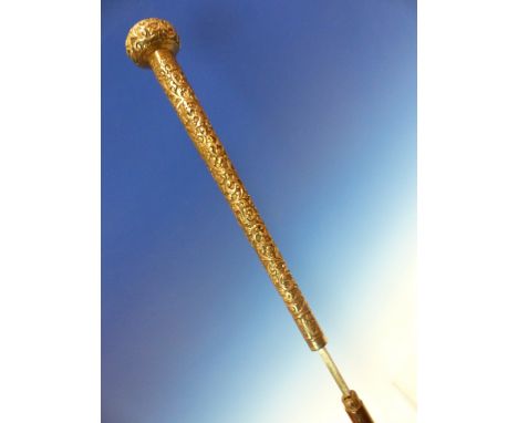 AN INDIAN WHITE METAL HANDLED SWORD STICK, THE CANE SCABBARD HOUSING A BLADE OF SQUARE SECTION.