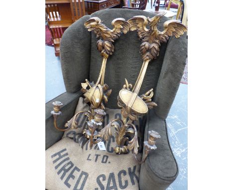 A PAIR OF GILTWOOD TWO LIGHT WALL  BRACKETS TOPPED BY SPREAD EAGLES, A DRUM BELOW ONE AND A HELMET BELOW THE OTHER.   APPROX.
