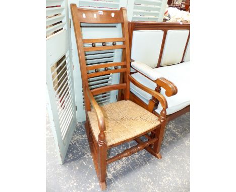 A 19th.C.RUSH SEAT LADDER BACK ROCKING CHAIR.