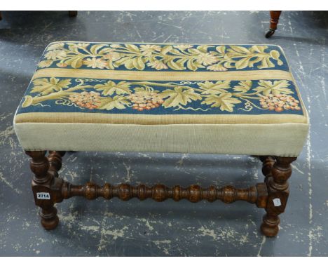 AN OAK STOOL, TAPESTRY SEAT OF FLOWERS AND OF GRAPES, BOBBIN TURNED.   W 66 x D 41 x H 37cms.