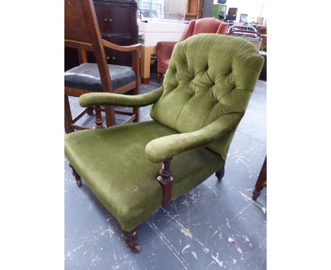 A VICTORIAN BUTTON BACK NURSING CHAIR ON TURNED FORELEGS.