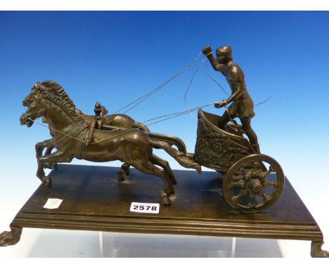 A 19th C. BRONZE GROUP OF A ROMAN CHARIOTEER DRIVING TWO HORSES, RECTANGULAR PLINTH.   W 37cms.