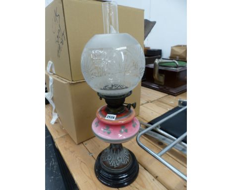 A VICTORIAN OIL LAMP WITH ETCHED SHADE, DUPLEX BURNER AND PINK RESERVOIR WITH CLOVER LEAF DECORATION. 