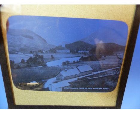 TWO BOXES OF PAPER MOUNTED GLAZED BLACK AND WHITE PHOTOGRAPHS FOR MAGIC LANTERN DISPLAY, LARGELY OF LAND AND TOWNSCAPES WITH 