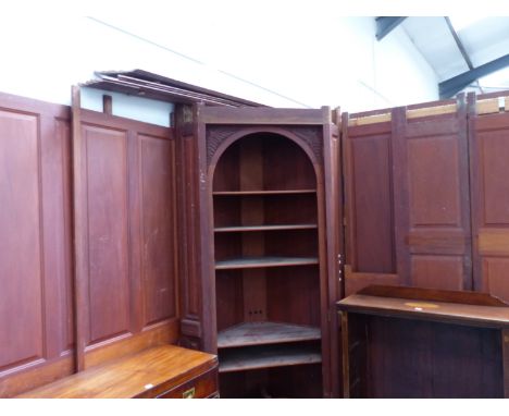 AN EXTENSIVE CARVED AND PANELLED WALNUT ARCHITECTURAL ROOM INTERIOR IN THE GEORGIAN TASTE, INCLUDES MANTLEPIECE, TWO CORNER C