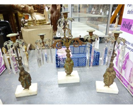 AN ANTIQUE GILT BRONZE AND MARBLE THREE PIECE MANTLE GARNITURE.  A THREE LIGHT CENTREPIECE, ALL SUPPORTED BY FIGURES OF EASTE