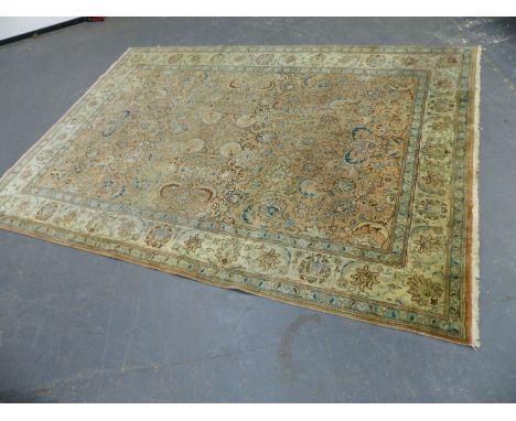A PERSIAN TABRIZ CARPET.  350 x 252cms.