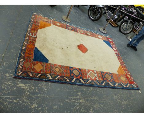 AN ORIENTAL TRIBAL CARPET.  284 x 212cms.