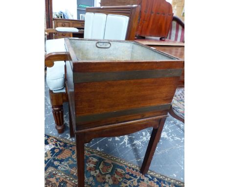 A 19th C. MAHOGANY PLANTER AND METAL LINER, THE SQUARE TOP ENCIRCLED BY TWO BRASS BANDS ABOVE A SERPENTINE APRON AND SQUARE L
