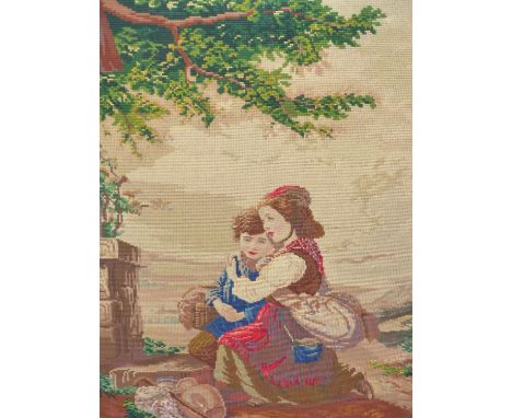 TWO UNFRAMED BERLIN WOOL WORK PICTURES, ONE DEPICTING AN ANGEL PLAYING TO THE MADONNA, CHILD AND ST JOSEPH AND THE LARGER WIT