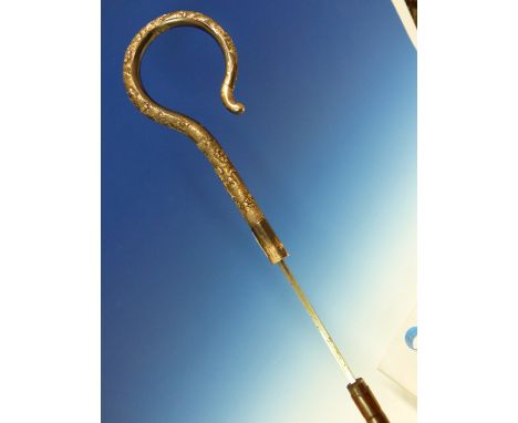 AN INDIAN WHITE METAL CROOK HANDLED SWORD STICK, THE WALKING CANE SCABBARD WITH BIRMINGHAM SILVER BAND.